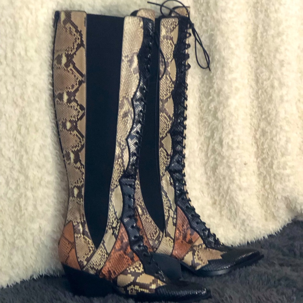Knee high Coach boots. Snake skin. NEVER WORN.